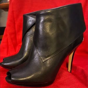 Micheal Kors heeled leather booties in black. Worn once